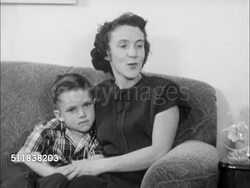 1950: DENVER, COLORADO: ADVICE: Bernadine Doyle Langfield sitting in living room w/ husband & children (husband holding toddler girl) SOT saying they got lots of letters, lots of advice. Instructional Video