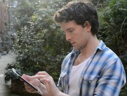 MS Shot of man using digital tablet outside / London, Greater London, United Kingdom Stock Footage