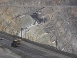 NTSC Large dump truck hauling iron ore in a mine Stock Footage