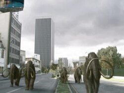 Long Shot static - A city crumbles around a herd of mastodons in a computer-generated animation. / Los Angeles, California, USA Stock Footage