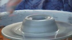 man creates pottery on a potter's wheel Stock Footage