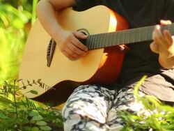 Teenager with accoustic guitar Series Stock Footage