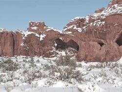MS ZO View of Fresh Snow on Red Rock Desert, Natural Arch / Moab, Utah, United States Stock Footage