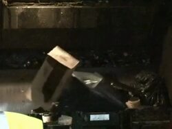 Medium Shot Zoom Out - Workers throw black plastic bags of trash into garbage truck / New Orleans Louisiana Stock Footage