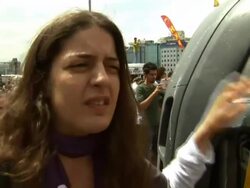Protester writing on Media truck and interview News Clip