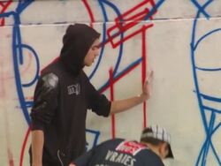 MS Shot of Graffiti artist spraying on wall / Paris, France Stock Footage