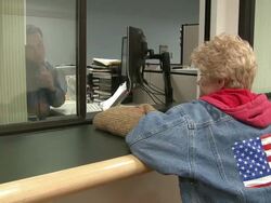 2009 MS Woman waiting as paperwork is processed at counter in job center/ Antioch, California, USA/ AUDIO Stock Footage