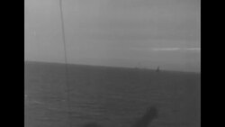 Ships on ocean during World War II, with guns firing News Clip
