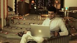 Adult man working on a laptop, Delhi, India Stock Footage