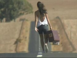 Rear view young woman carrying suitcase, Cape Town, South Africa Stock Footage