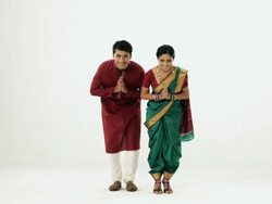 Portrait of a marathi couple welcoming  Stock Footage