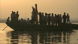 Passengers stand in a boat with a representation of Lakshmi during a Diwali celebration. Stock Footage