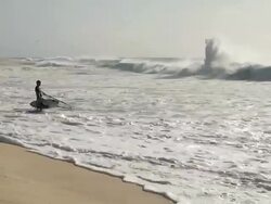 MS View of Man waiting of big waves for wind sail surfing at beach near Santa Maria / Santa Maria, Sal, Cape Verde Stock Footage