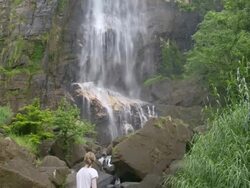Tourist at Bambarakanda Falls, a waterfall near Haputale, Sri Lanka Hill Country, Nuwara Eliya District, Asia  Stock Footage