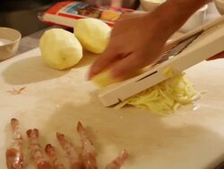 MS Prawn dish preparation at a kitchen grating potato / Sao Paulo, Brazil Stock Footage