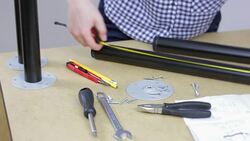 Young female taking measurements and notes to assemble new furniture in the workshop. Stock Footage
