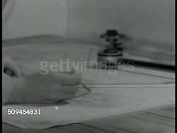 1942: U.S. MARINES: ALL HANDS: INT VS Navy officers, radioman, looking over maps, planning. EXT MS Fighter airplanes (possibly P-36 Hawk) rising on elevator to carrier deck (dark). WWII, Guadalcanal Instructional Video
