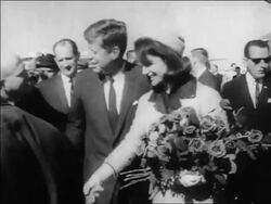 B/W 1963 John + Jacqueline Kennedy shaking hands with people at Dallas airport / newsreel Stock Footage