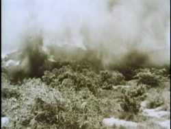 A North Vietnamese Soldier gestures and shouts for a bazooka to be fired during a battle of the Vietnam War. News Clip