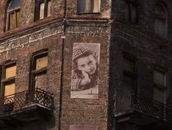 C/U old Photo of a jewish girl on the memorial jewish house Stock Footage
