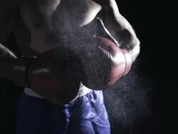 HD SUPER SLOW MO: Boxer Punching Gloves Together Stock Footage
