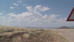 A road sign in the Namib Desert warns of crossing animals. Stock Footage