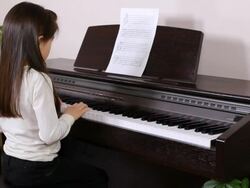 Little Girl practices piano Stock Footage