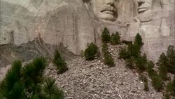 A pile of rocks rest under Mount Rushmore. Stock Footage