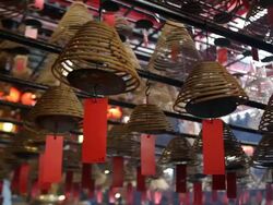 MS PAN Incense coils hanging in Man Mo Temple / Hong Kong, Hong Kong, China Stock Footage