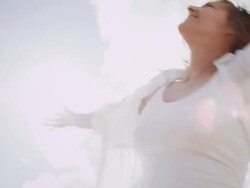 Woman spinning on beach Stock Footage