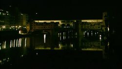 A canal reflects city lights in Florence. Stock Footage