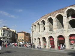 MS Shot of Tourists roaming in front of Arena di Verona at Piazza Bra / Verona, Veneto, Italy Stock Footage