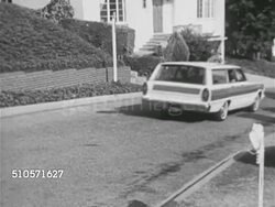 1965: LIFESTYLE CARS: TRACKING Station wagon w/ family passing on neighborhood street, VS Middle-aged couple driving new Buick convertible, VS Blonde adult couple driving in new 1965 Chevrolet Corvette convertible, talking, smiling. Instructional Video