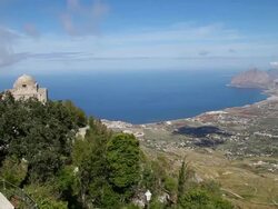 Erice, view of the San Giovanni Battista church, and the valley and coast of the Mediterranean sea Stock Footage