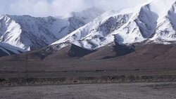 truck driving on highway through tibetan plateau Stock Footage