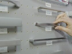 ECU hand of woman checking furniture fittings on a showroom display Stock Footage