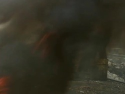 MS Shot of men burning plastic from electric cables to recover copper and others scavenging scrap metal / Lagos, Nigeria Stock Footage