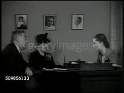 1946: ADOPTION OFFICE: DRAMATIZATION: Older couple (50's) talking w/ Social Worker SOT saying a child would disturb their peace, if adopting baby now they would be 70 by the time the child went to college. Woman sighing, looking at husband. Instructional Video