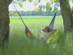 Man resting in Hammock, Peace of mind Stock Footage