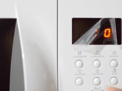 set up and run program on microwave Stock Footage