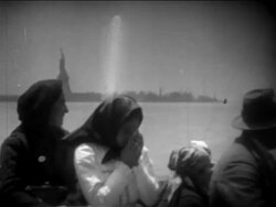 B/W 1900s immigrants on boat deck passing Statue of LIberty / one girl crying / newsreel Stock Footage