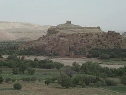 An expansive shot of an old style world. Rustic houses climb amongst the Moroccan hills. Stock Footage