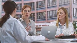 LD Project manager in meeting with two female doctors Stock Footage