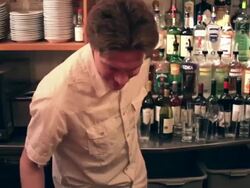 A bartender cleans behind the bar. Stock Footage