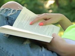 Girl reading book Stock Footage