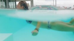 Woman swimming in pool Stock Footage