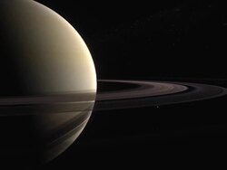 The planet Saturn with its ring system and inner moons Stock Footage