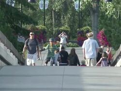 MS People walking on  short bridge  / Calgary, Alberta, Canada Stock Footage