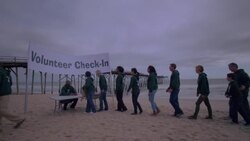 Volunteers line up for check in Stock Footage