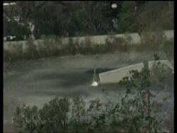 Attempts to repair breached levee, latest shots of floods News Clip